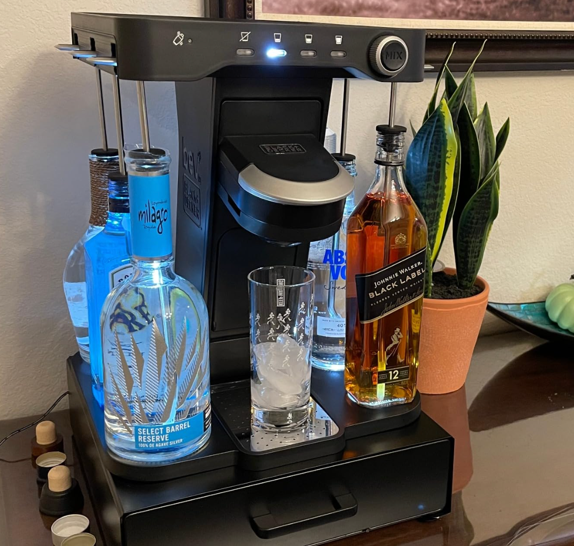 reviewers drink maker with bottles of liquor attached