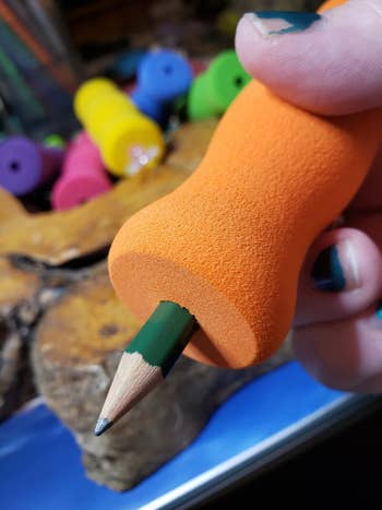 close-up of an orange foam grip on a pencil