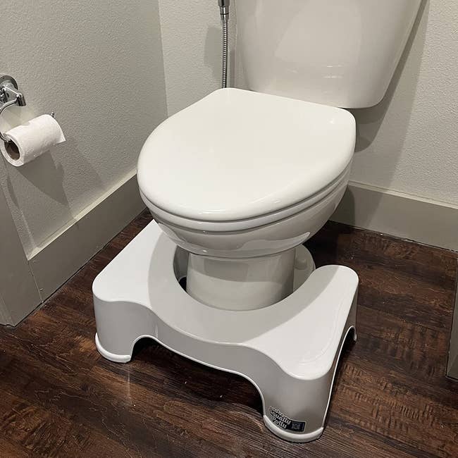 reviewer's squatty potty successful beforehand of a toilet