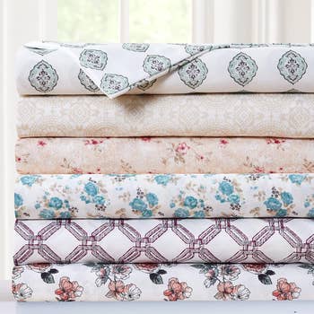 Stack of various patterned bedding sheets