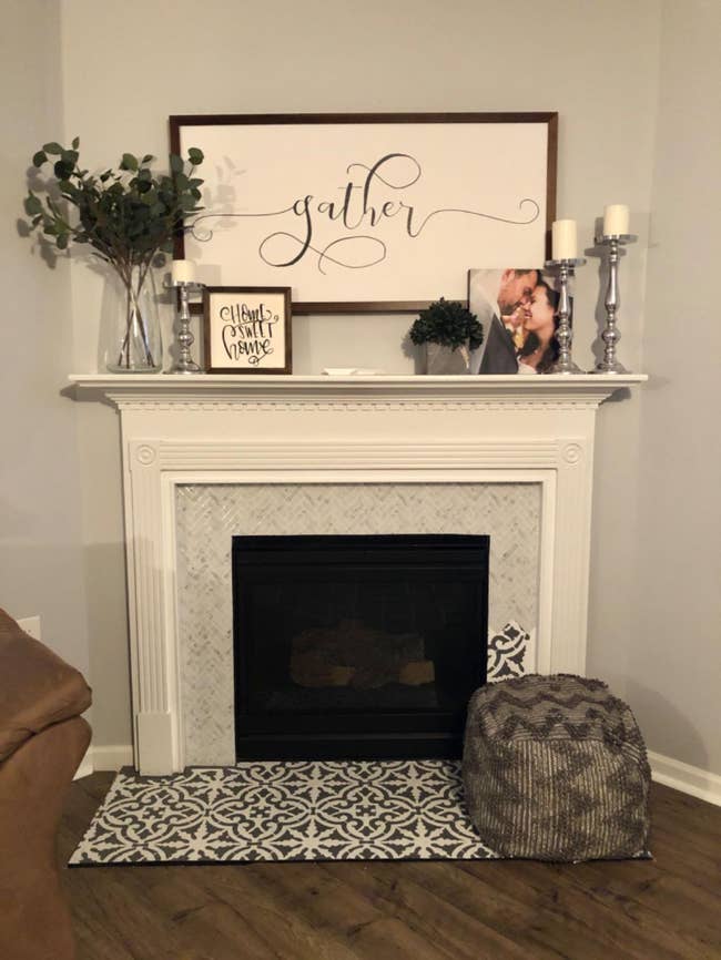 The tile in the color Carara White adhered to a fireplace mantle