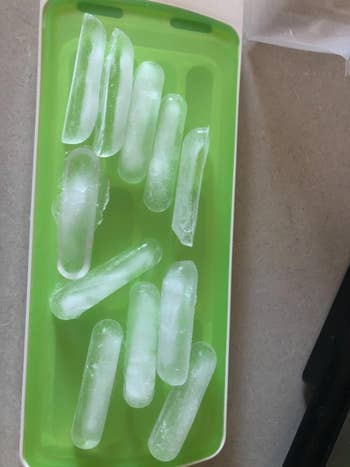 a reviewer photo of stick ice cubes made in the tray 