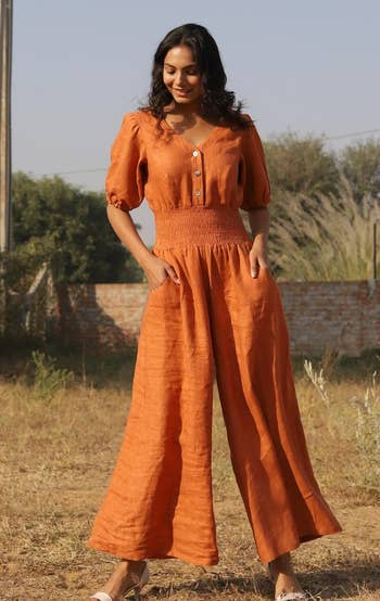 model wearing the orange jumpsuit