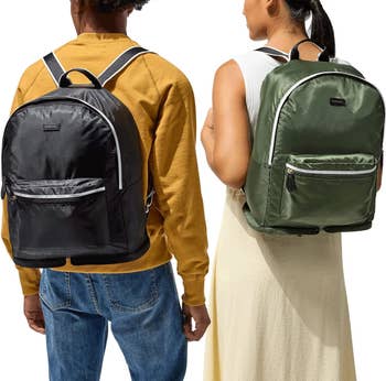 two models each wearing one of the backpacks in a different color 