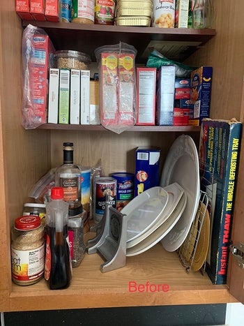 reviewer image showing their cabinet before using the bakeware rack