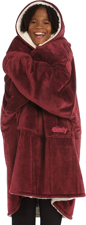 child wearing The Comfy in burgundy