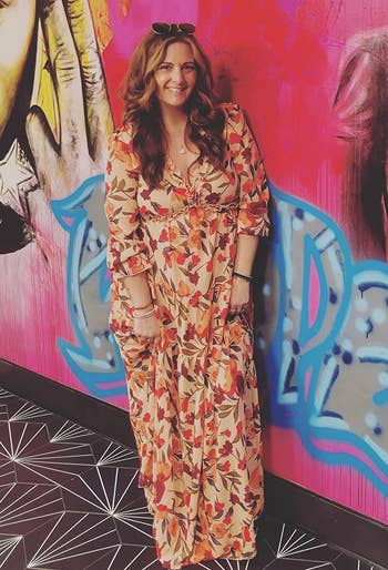 Image of reviewer wearing long floral dress