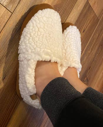 close-up of another reviewer wearing the white slippers