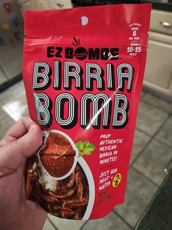hand holding Birria Bomb bag
