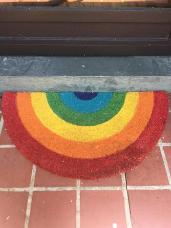 a reviewer's rainbow door mat