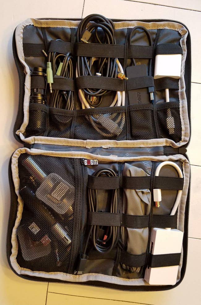 Reviewer's tech organizer filled with cables and chargers
