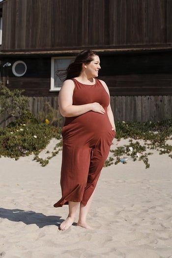 pregnant model wearing the rust colored dress