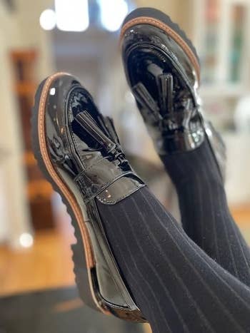 Shiny patent leather loafers with chunky soles and achromatic  pinstripe socks