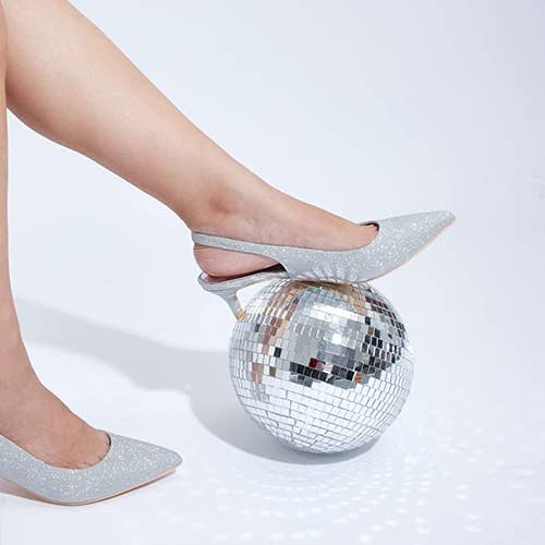 model wearing the heels in silver sparkle
