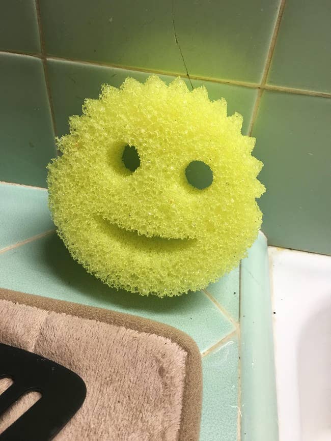 a yellow sponge that looks like a smiley face