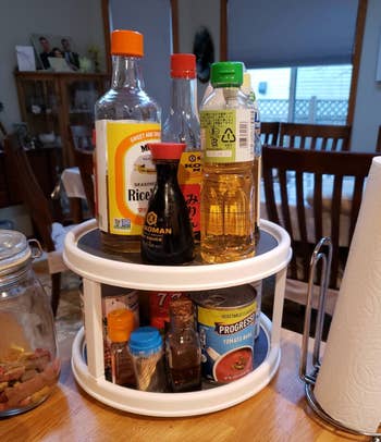 reviewer photo of sauces and cans of soup on the lazy susan