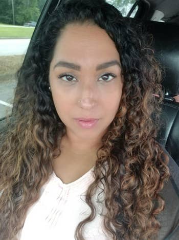 reviewers long curly hair with defined, frizz-free curls after using the product