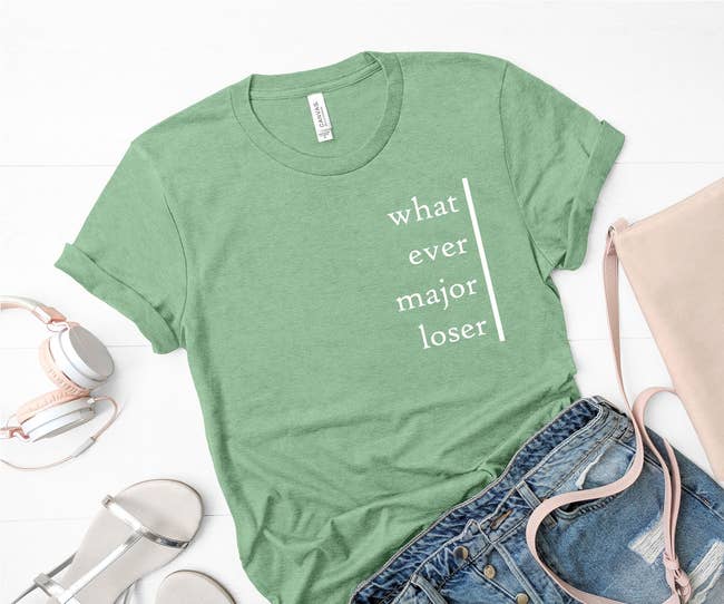 green tee featuring white text that reads what ever major loser