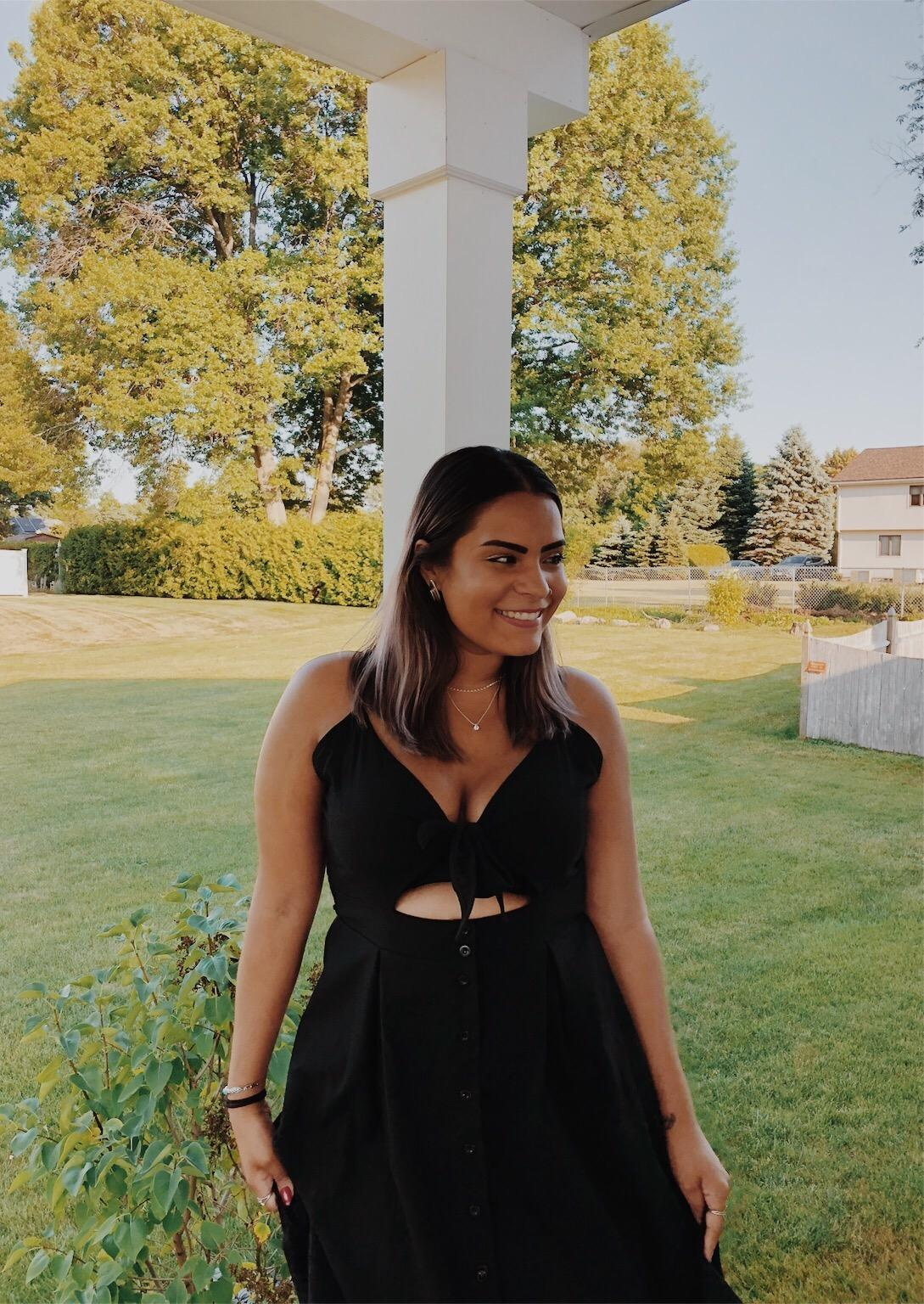 Person lasting  outdoors successful  a chic achromatic  formal  with a necktie  beforehand   and cutout, smiling, with trees and a location   successful  the background