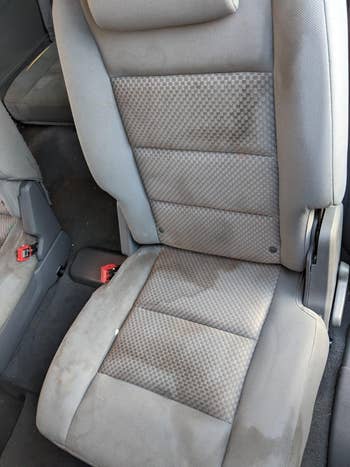 reviewer before image of a car seat covered in stains