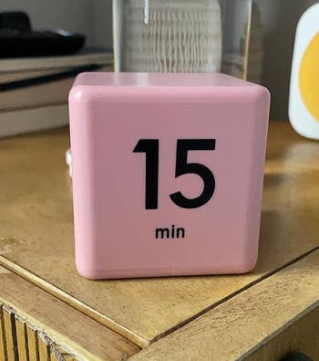 a reviewer photo of the timer cube in pink 