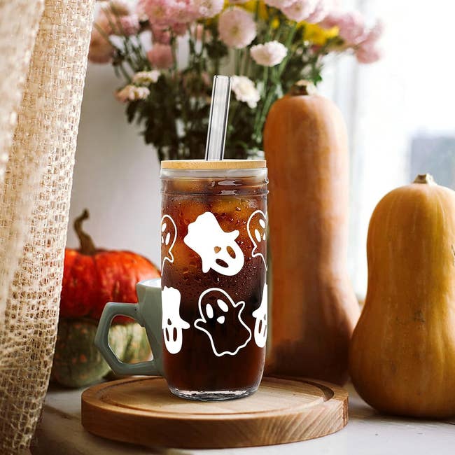 a glass tumbler with ghosts on it