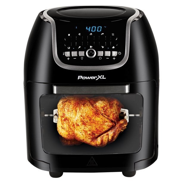 An air fryer with a whole chicken