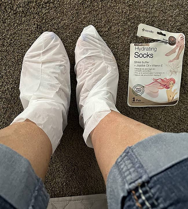 reviewer wearing hydrating foot masks