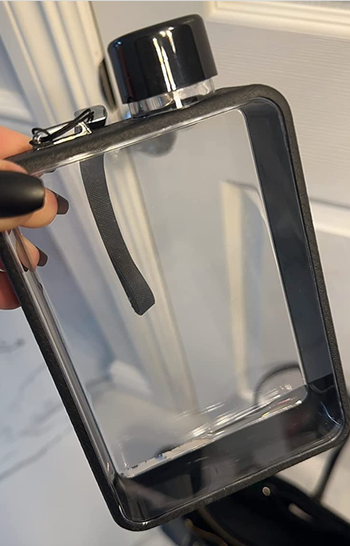clear rectangle shaped water bottle with black edges and lid