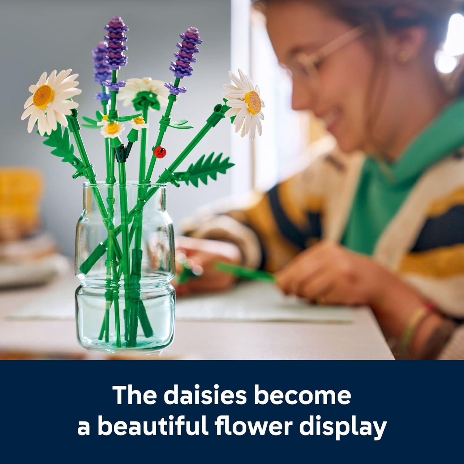 A idiosyncratic   arranges a LEGO angiosperm  bouquet successful  a jar connected  a table, featuring daisies and lavender