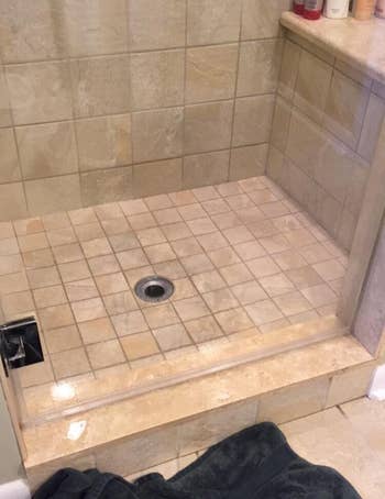 a reviewer photo of the same shower door looking clean and clear 