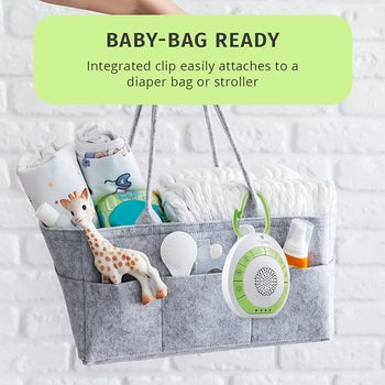 The white noise machine clipped to a diaper bag
