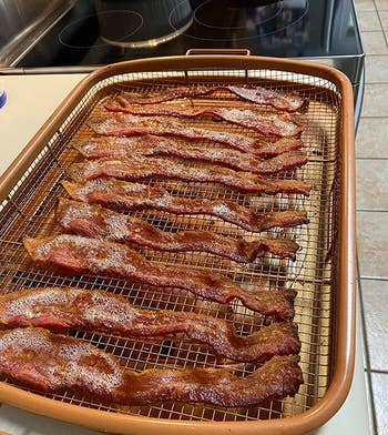 reviewer photo of bacon cooling on the rack