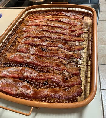 reviewer photo of bacon cooling on the rack