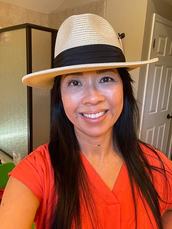 another reviewer wearing the hat