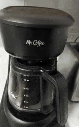 gif of another reviewer pushing the sliding tray back and forth, which is holding a coffee maker