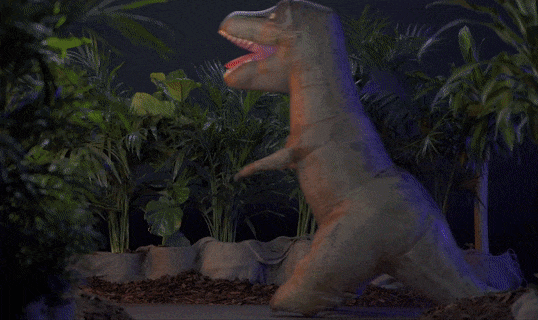 gif of child and remote control inflatable dinosaur