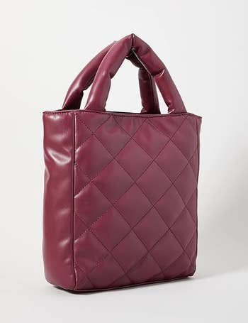 red faux-leather tote bag with quilted pattern