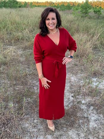 reviewer wearing red belted maxi dress