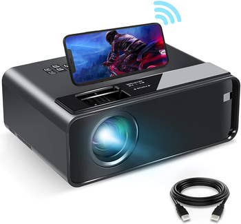 projector with phone on top of it