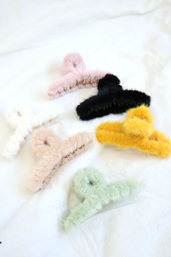 product image of five different colored teddy hair clips