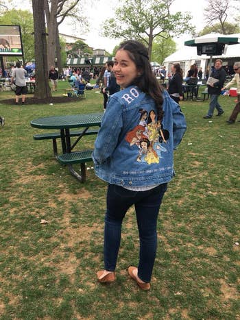 buzzfeed editor wearing a denim jacket with disney princesses from the '90s on the back