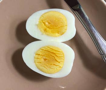 reviewer photo of a perfectly cooked hardboiled egg sliced in half