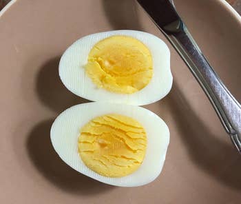 reviewer photo of a perfectly cooked hardboiled egg sliced in half