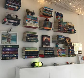 another reviewer image of several floating shelves on the wall holding books