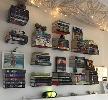 another reviewer image of several floating shelves on the wall holding books