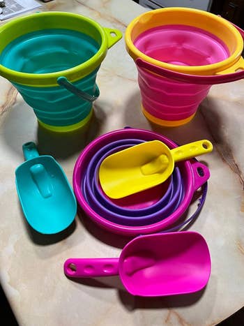 a reviewer's colorful buckets with some collapsed 