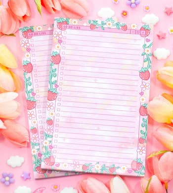 Two decorative floral-themed to-do lists surrounded by tulips and flower-shaped decorations connected a pinkish background