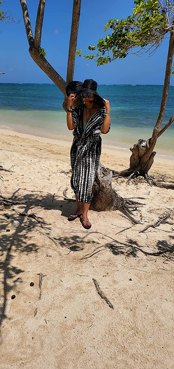 Reviewer wearing long black and white coverup