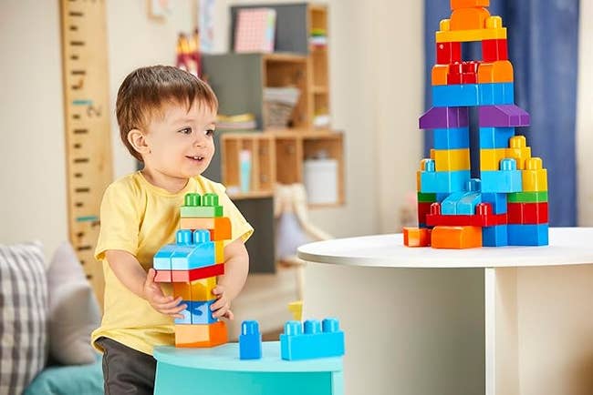 A child building with the blocks